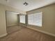 Bright bedroom features a mirrored closet and a window for natural light at 3005 Treasure Island Rd, Las Vegas, NV 89128