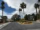 The Crosspointe neighborhood has palm trees and green landscaping at the entrance at 3005 Treasure Island Rd, Las Vegas, NV 89128