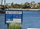 Informative community sign at Desert Shores, outlining member access and boating rules near the waterfront at 3005 Treasure Island Rd, Las Vegas, NV 89128