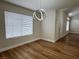Dining room with modern light fixture and window with blinds at 3005 Treasure Island Rd, Las Vegas, NV 89128