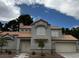 Well maintained house exterior with a red tile roof and manicured landscaping at 3005 Treasure Island Rd, Las Vegas, NV 89128