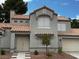 Attractive two-story home with a tile roof and an attached two-car garage at 3005 Treasure Island Rd, Las Vegas, NV 89128