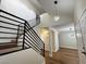 Contemporary foyer with new flooring, modern light fixtures, and open staircase at 3005 Treasure Island Rd, Las Vegas, NV 89128
