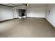Spacious garage featuring an epoxy floor and two doors at 3005 Treasure Island Rd, Las Vegas, NV 89128