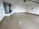 Spacious garage featuring an epoxy floor and a side door, offering ample parking and storage at 3005 Treasure Island Rd, Las Vegas, NV 89128