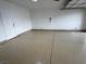 Clean, epoxy garage floor and white walls and a white door at 3005 Treasure Island Rd, Las Vegas, NV 89128