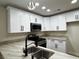Kitchen boasting white cabinets, stainless steel appliances, and a stylish sink at 3005 Treasure Island Rd, Las Vegas, NV 89128