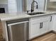 Kitchen with white cabinets and drawers, stainless steel appliances, granite countertops, and a double sink at 3005 Treasure Island Rd, Las Vegas, NV 89128