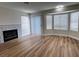 Open-concept living room featuring a fireplace and bay windows at 3005 Treasure Island Rd, Las Vegas, NV 89128