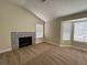 Spacious loft featuring fireplace with decorative tile accent wall and natural light at 3005 Treasure Island Rd, Las Vegas, NV 89128