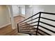 Modern staircase with metal railings overlooking the second floor of the home at 3005 Treasure Island Rd, Las Vegas, NV 89128
