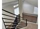 Modern staircase with iron railings and views of multiple windows at 3005 Treasure Island Rd, Las Vegas, NV 89128