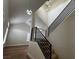 Staircase featuring linear metal railings with modern light fixtures in the foyer at 3005 Treasure Island Rd, Las Vegas, NV 89128