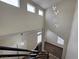 Modern home staircase with black railings and contemporary light fixture at 3005 Treasure Island Rd, Las Vegas, NV 89128