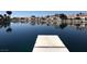 Picturesque water view showing calm lake reflecting houses under blue skies from a dock at 3005 Treasure Island Rd, Las Vegas, NV 89128
