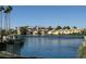 Scenic waterfront view surrounded by lush greenery, trees, and nearby houses, creating a picturesque community setting at 3005 Treasure Island Rd, Las Vegas, NV 89128