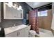 Unique bathroom featuring a tub with skull shower curtain, sink, and vanity at 3018 Burnham Ave, Las Vegas, NV 89169