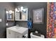 Charming bathroom features a white vanity and custom skull shower curtain at 3018 Burnham Ave, Las Vegas, NV 89169