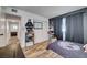 Bedroom featuring wood-look flooring and bright interior access at 3018 Burnham Ave, Las Vegas, NV 89169