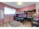 Cozy bedroom with a bunk bed, wood-look flooring, and natural lighting at 3018 Burnham Ave, Las Vegas, NV 89169