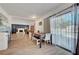 Bright dining area with hardwood floors and sliding doors leading to the pool at 3018 Burnham Ave, Las Vegas, NV 89169
