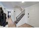Inviting entryway featuring hardwood floors, staircase and direct access to the living spaces at 3018 Burnham Ave, Las Vegas, NV 89169