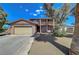 Charming two-story home featuring a large front yard and a two-car attached garage at 3018 Burnham Ave, Las Vegas, NV 89169