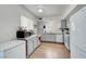 Well-lit kitchen featuring updated appliances and hardwood floors at 3018 Burnham Ave, Las Vegas, NV 89169
