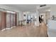 Open-concept living and dining area featuring hardwood floors and staircase access at 3018 Burnham Ave, Las Vegas, NV 89169