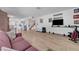 Open-concept living room with hardwood floors and plenty of natural light at 3018 Burnham Ave, Las Vegas, NV 89169