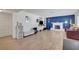 Bright living room with wood flooring, a decorative fireplace, and ample space for entertaining at 3018 Burnham Ave, Las Vegas, NV 89169