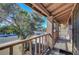 Exterior view of porch with a wood railing and view of the street at 3018 Burnham Ave, Las Vegas, NV 89169