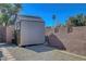 Durable outdoor shed with great storage, set against a secure brick wall and gravel ground at 3018 Burnham Ave, Las Vegas, NV 89169