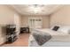 Comfortable bedroom featuring wood floors, ceiling fan, and a queen sized bed at 307 Oak Canyon Dr, Henderson, NV 89015