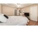 Large bedroom featuring a television, a ceiling fan, and wood-look floors at 307 Oak Canyon Dr, Henderson, NV 89015