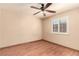 Empty bedroom featuring wood floors, a window, and a ceiling fan at 307 Oak Canyon Dr, Henderson, NV 89015