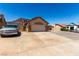 Single-story home showcasing a concrete driveway, a garage, and desert-friendly landscaping at 307 Oak Canyon Dr, Henderson, NV 89015