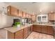 Kitchen area that features stainless steel appliances and a large island at 307 Oak Canyon Dr, Henderson, NV 89015