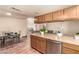 Open kitchen design features stainless appliances, counter seating, and a seamless flow to the dining area at 307 Oak Canyon Dr, Henderson, NV 89015