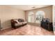 Cozy living room with tile flooring and arched windows at 307 Oak Canyon Dr, Henderson, NV 89015