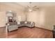 Cozy living room with vaulted ceilings, wood floors, and a comfortable sectional sofa at 307 Oak Canyon Dr, Henderson, NV 89015