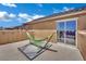 Relaxing balcony featuring a hammock, rug, and glass sliding doors with a view at 3217 Bonassola Ave, North Las Vegas, NV 89031