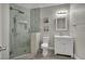 Modern bathroom featuring a glass-enclosed shower, vanity, and tile flooring at 3217 Bonassola Ave, North Las Vegas, NV 89031