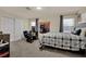 Bedroom with desk, ample lighting and dark grey carpet at 3217 Bonassola Ave, North Las Vegas, NV 89031