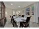 Spacious dining room with hardwood floors, a large table setting, and great natural lighting at 3217 Bonassola Ave, North Las Vegas, NV 89031