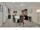 Formal dining room with hardwood floors, dining table and decor, and a built-in wine cooler at 3217 Bonassola Ave, North Las Vegas, NV 89031