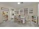 Bright dining room with a table set for a meal, complemented by natural light at 3217 Bonassola Ave, North Las Vegas, NV 89031