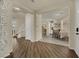 Inviting foyer showcasing wood floors, staircase, and an open view into the dining area at 3217 Bonassola Ave, North Las Vegas, NV 89031