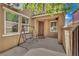 Inviting front porch with a swing and a stylish front door, offering a welcoming entrance at 3217 Bonassola Ave, North Las Vegas, NV 89031