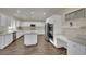 Bright kitchen with white cabinets, stainless steel appliances, and a spacious island at 3217 Bonassola Ave, North Las Vegas, NV 89031